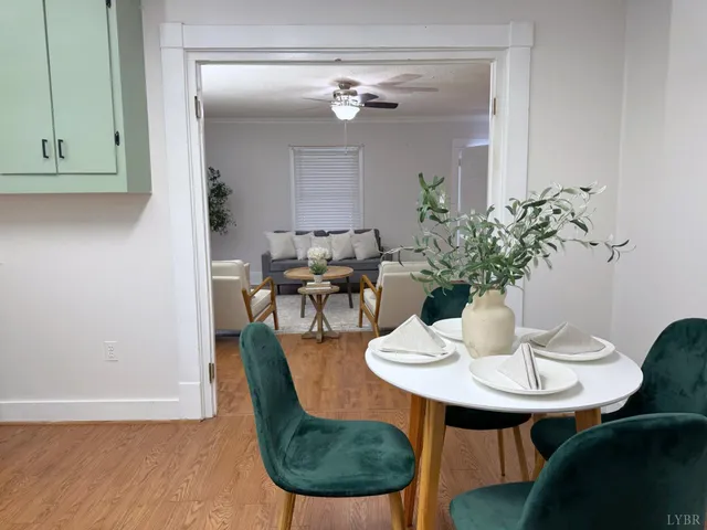 a dining room with furniture and wooden floor