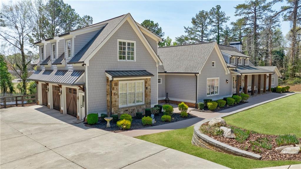 3680 Sewell Mill Road Marietta, GA 30062 - Photo 1 of 1 a front view of a house with a garden