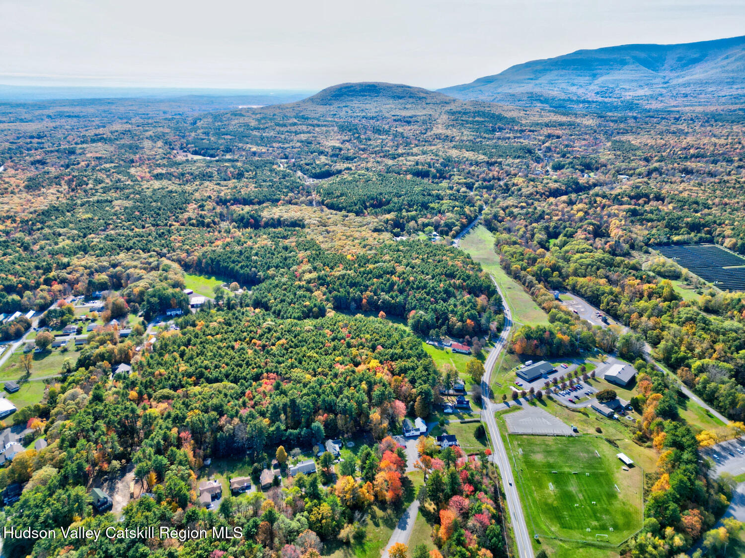 460 Main Street Cairo, NY 12413 - Photo 12 of 71 an aerial view of residential house with yard and mountain view in back