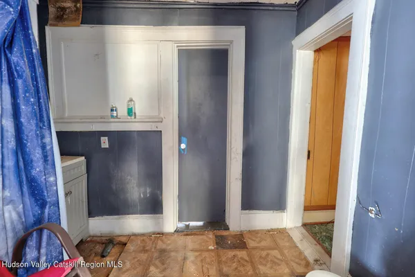 a living room with furniture and a dining table
