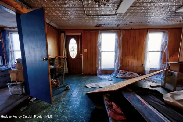 a view of an entryway with wooden floor