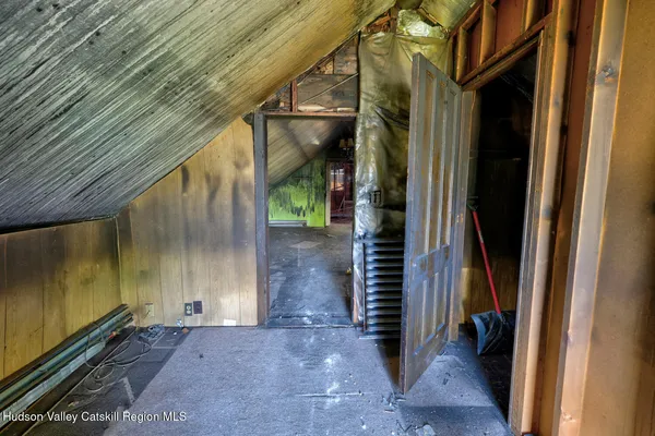 a view of hall way with furniture