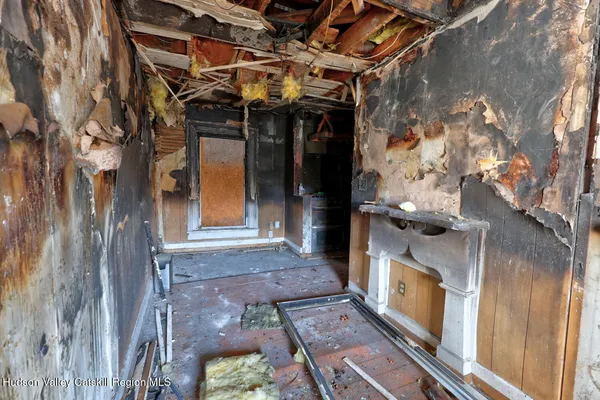 a front view of a house with parking space