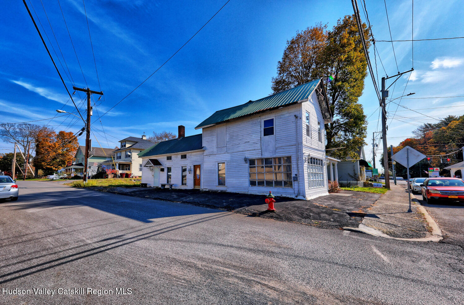 460 Main Street Cairo, NY 12413 - Photo 60 of 71 a side view of a house with cars parked on the road