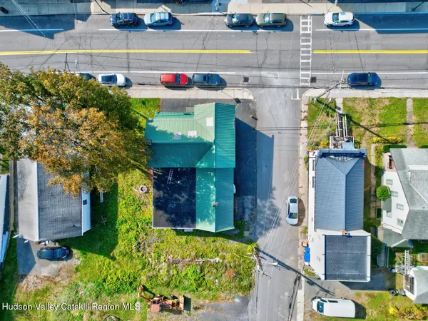 an aerial view of residential house and sandy dunes