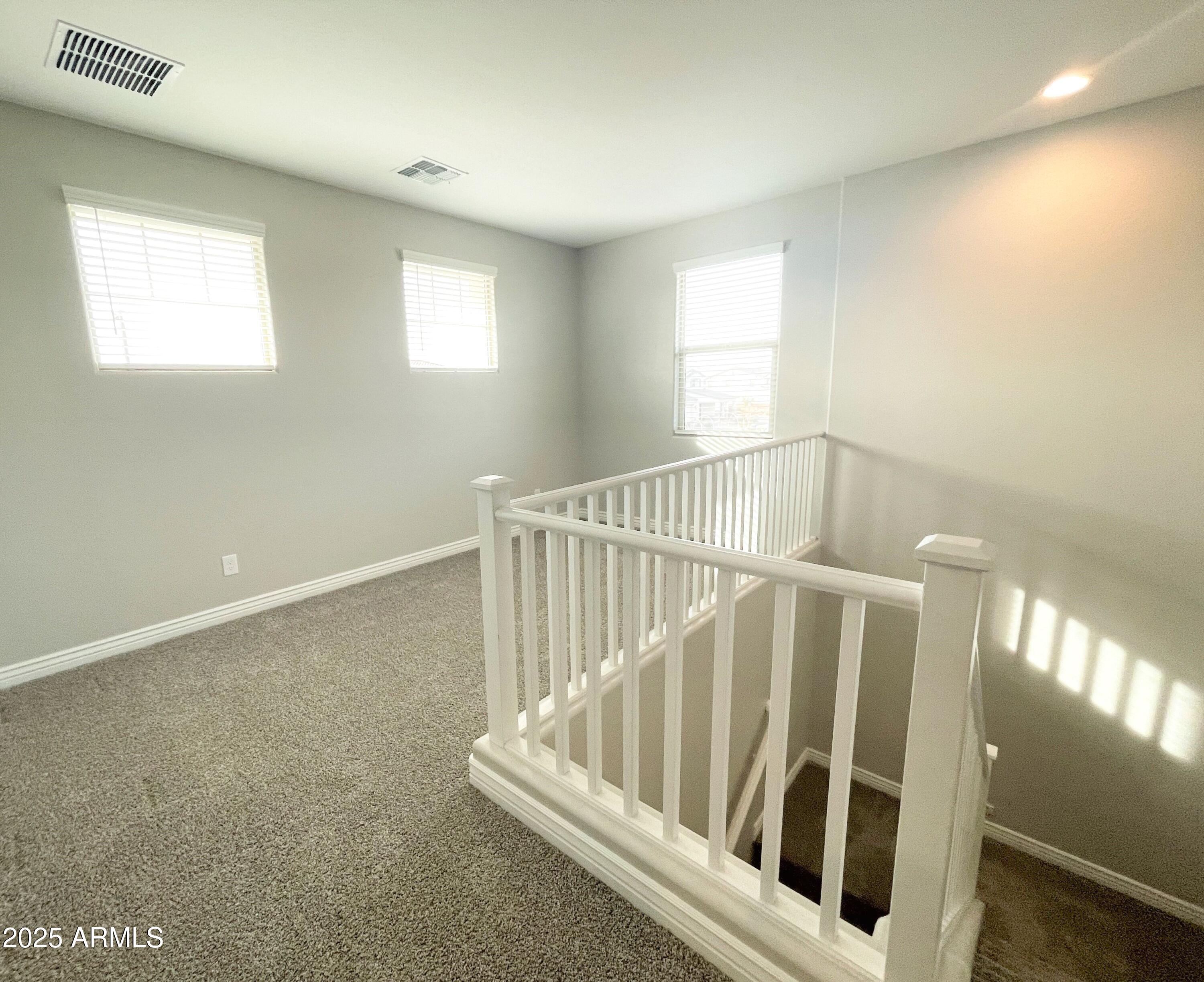 21046 East Mayberry Road Queen Creek, AZ 85142 - Photo 14 of 32 a view of staircase with white walls and a window