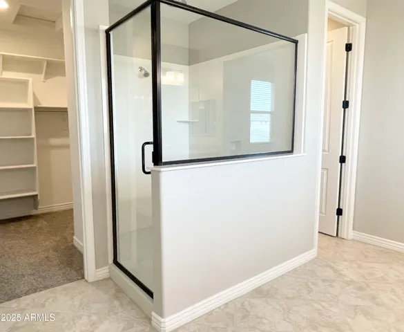 a bathroom with a granite countertop sink and a large mirror