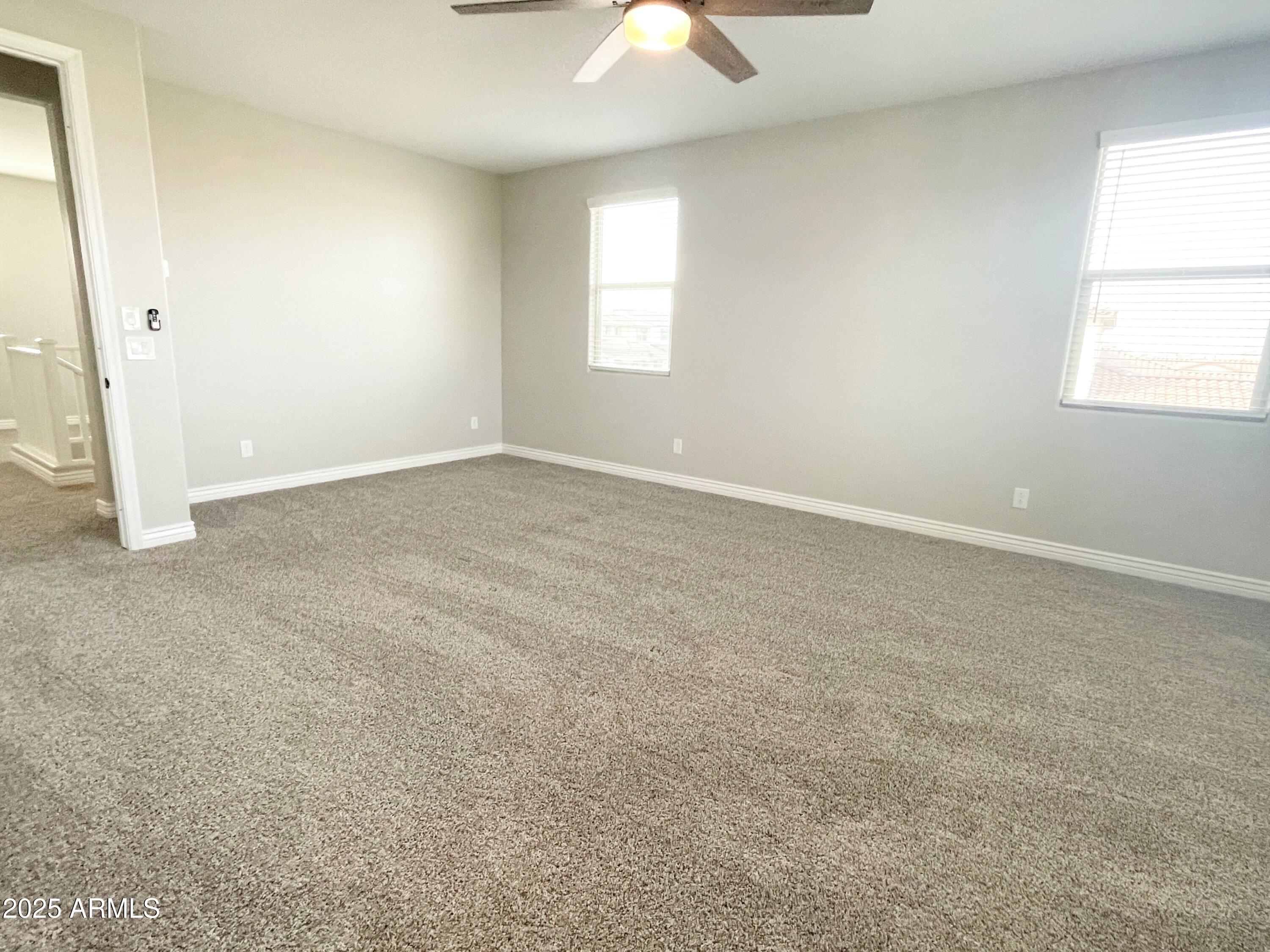 21046 East Mayberry Road Queen Creek, AZ 85142 - Photo 21 of 32 an empty room with a window