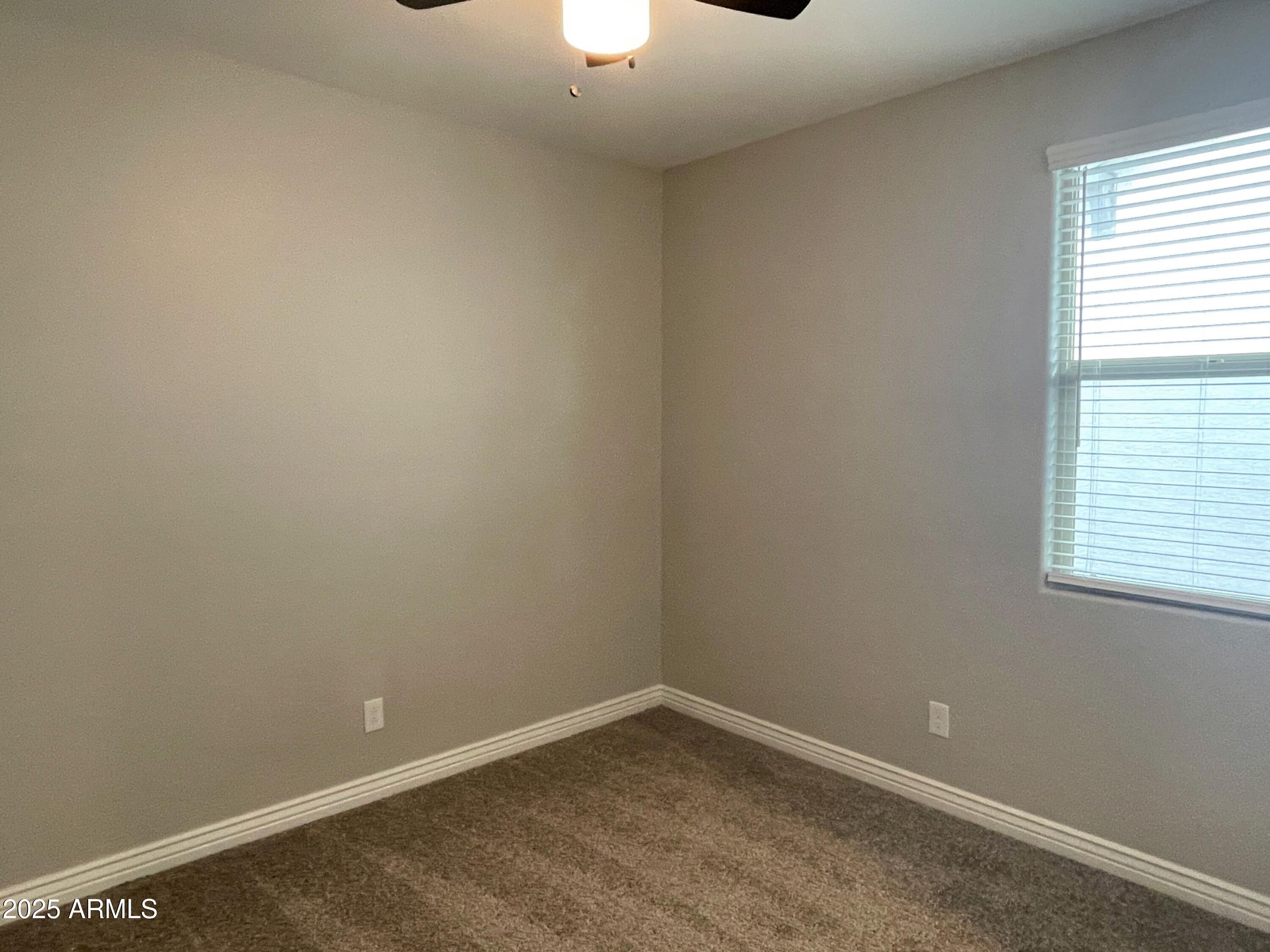 21046 East Mayberry Road Queen Creek, AZ 85142 - Photo 26 of 32 an empty room with a window