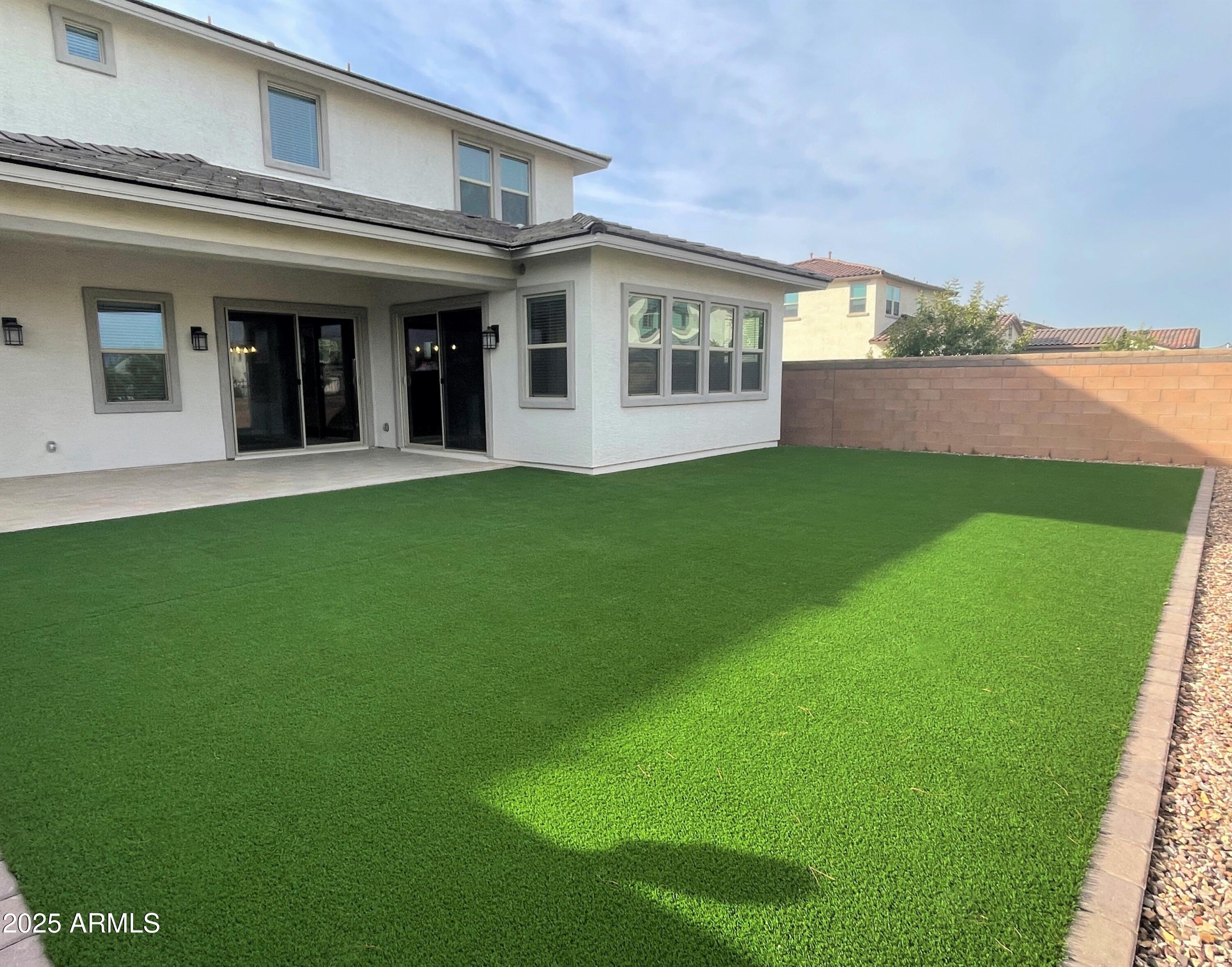 21046 East Mayberry Road Queen Creek, AZ 85142 - Photo 30 of 32 a view of a house with a backyard
