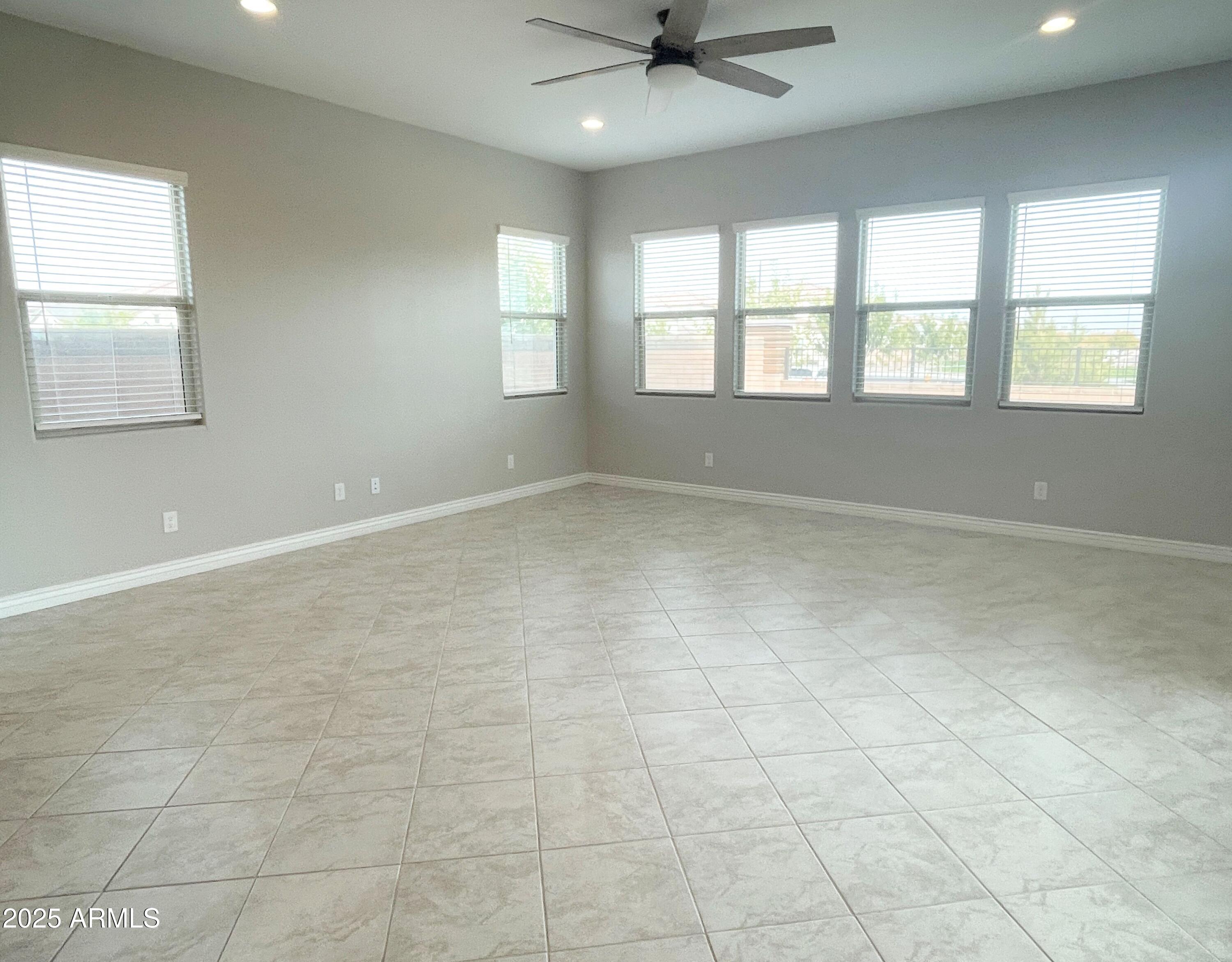 21046 East Mayberry Road Queen Creek, AZ 85142 - Photo 4 of 32 a view of an empty room with a window