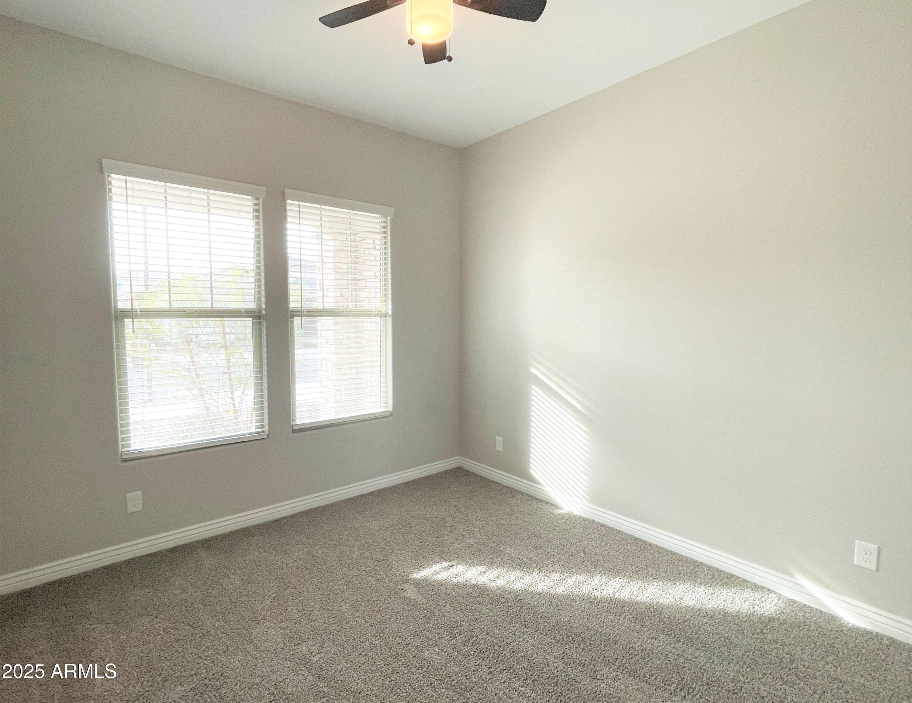 21046 East Mayberry Road Queen Creek, AZ 85142 - Photo 10 of 32 an empty room with a window