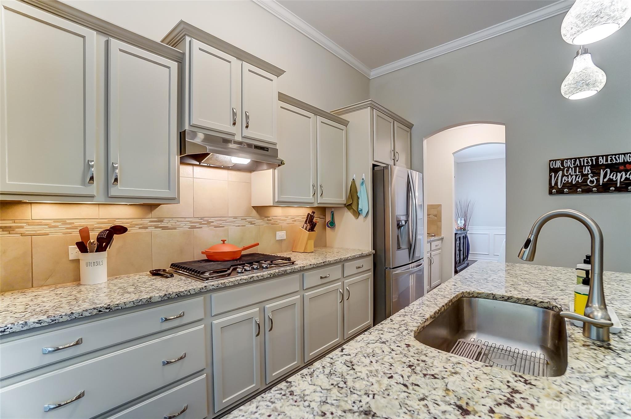 1862 Larkspur Way Tega Cay, SC 29708 - Photo 13 of 37 a kitchen with stainless steel appliances granite countertop a sink stove and refrigerator