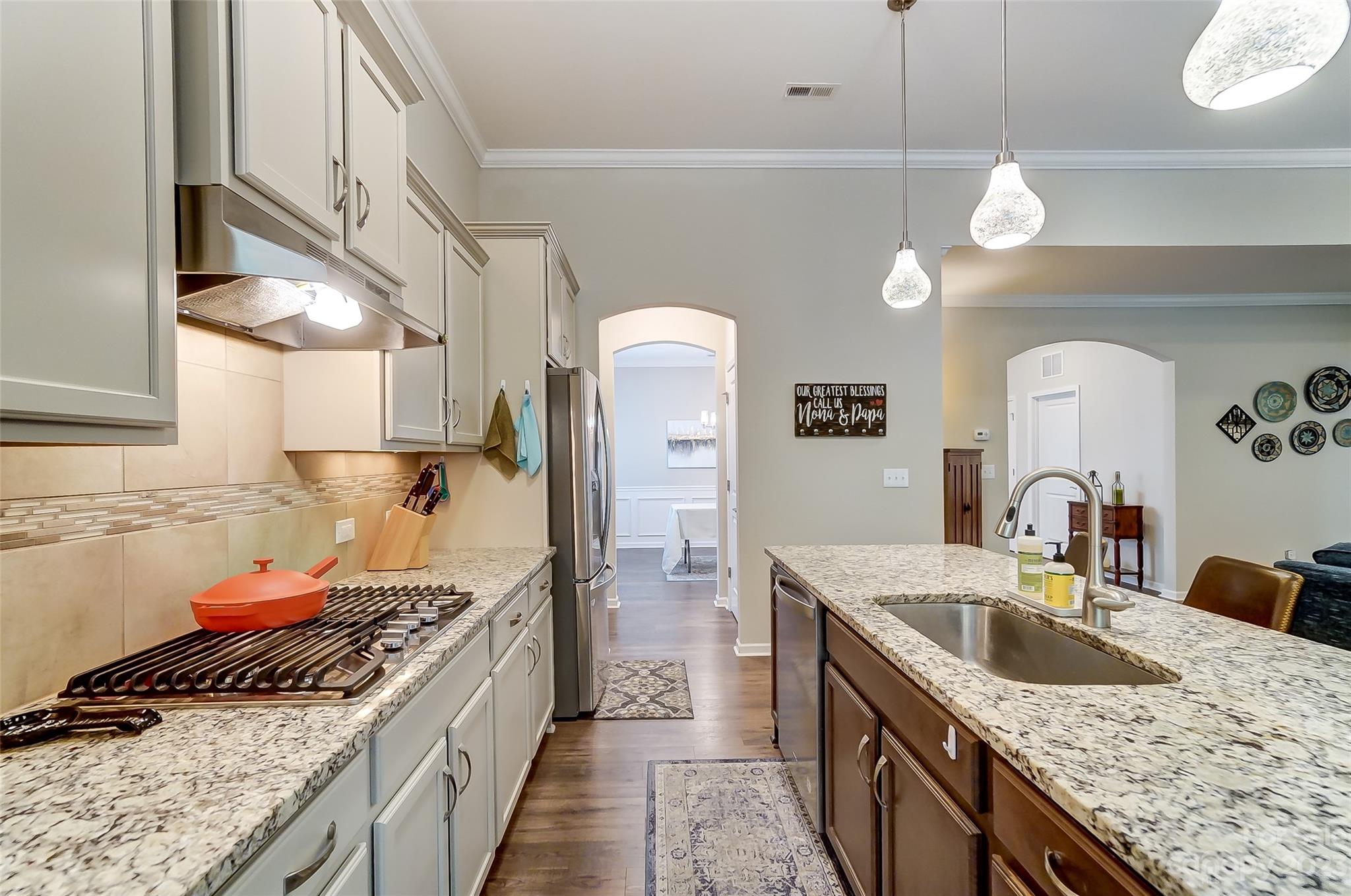 1862 Larkspur Way Tega Cay, SC 29708 - Photo 14 of 37 a kitchen with a stove and a sink