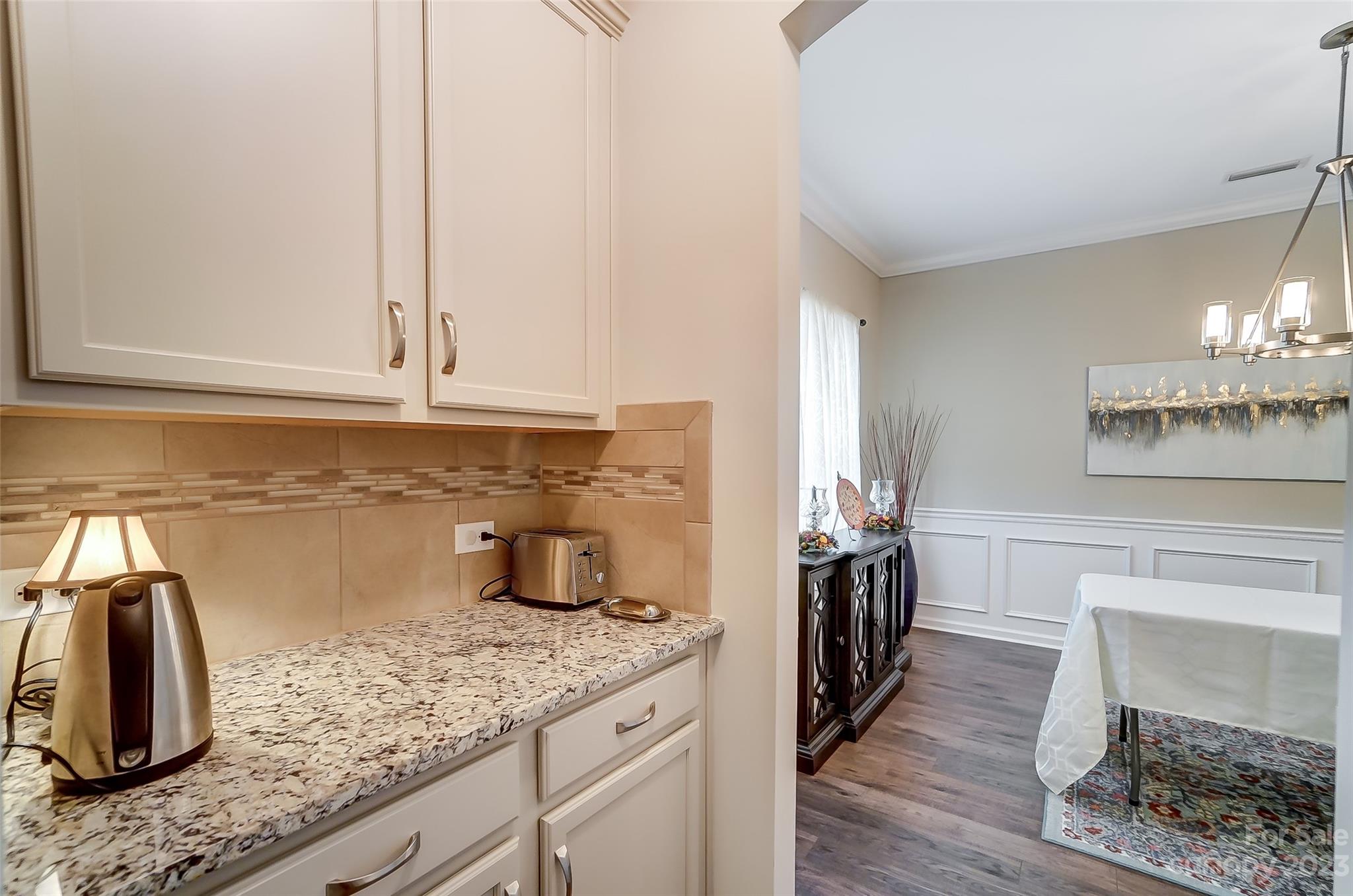 1862 Larkspur Way Tega Cay, SC 29708 - Photo 18 of 37 a kitchen with granite countertop a sink and a stove top oven