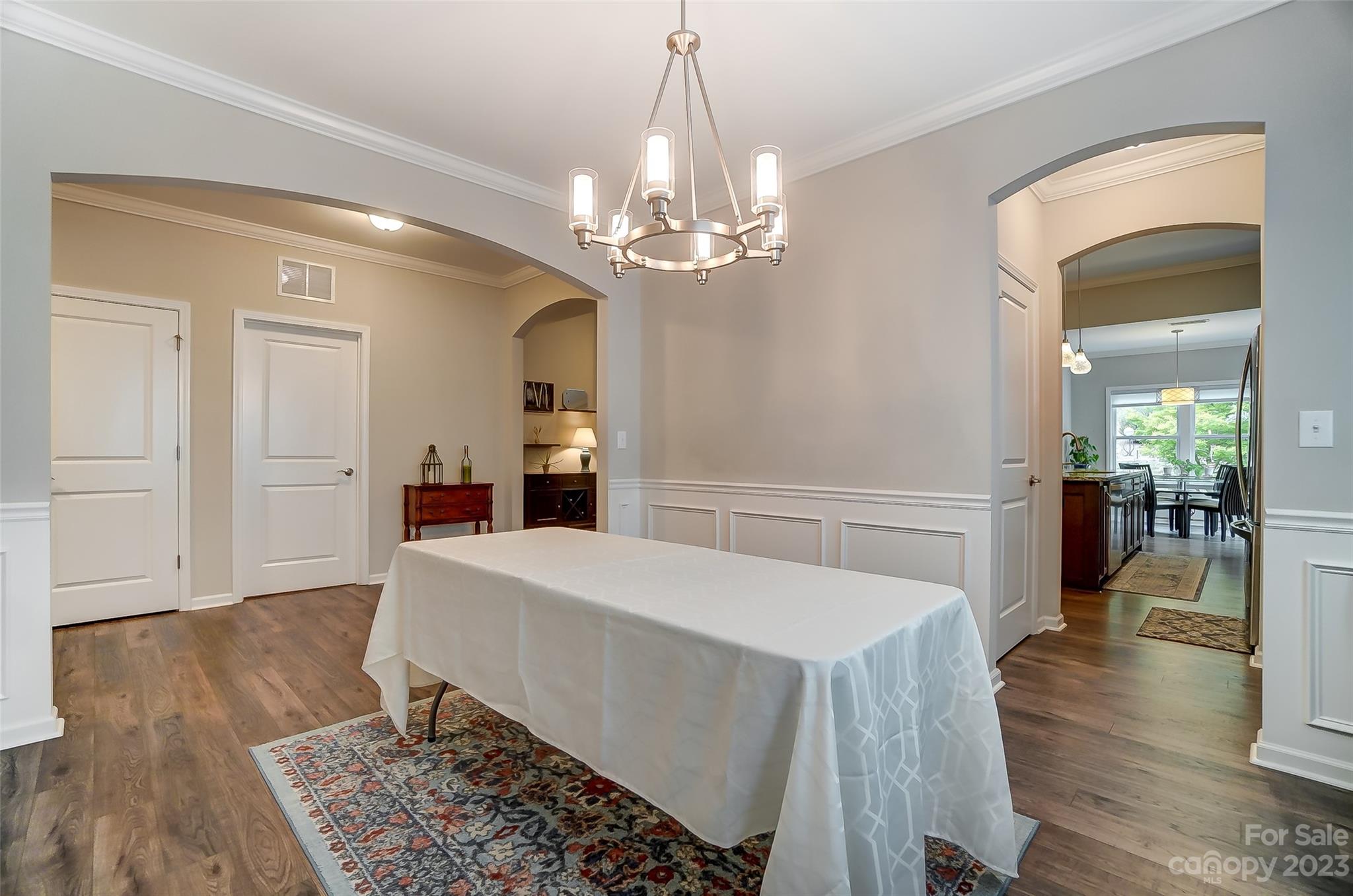 1862 Larkspur Way Tega Cay, SC 29708 - Photo 20 of 37 a view of a dining room with furniture and wooden floor