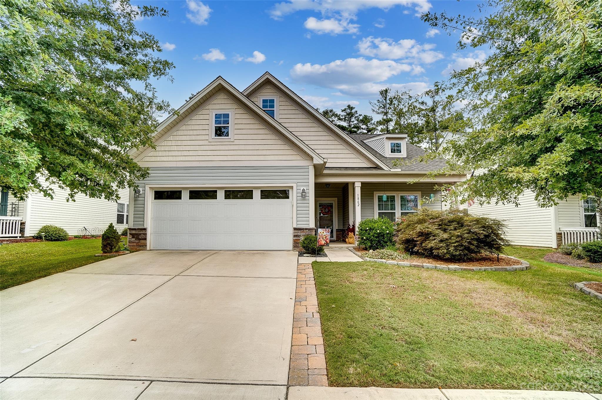 1862 Larkspur Way Tega Cay, SC 29708 - Photo 2 of 37 a view of house with garden