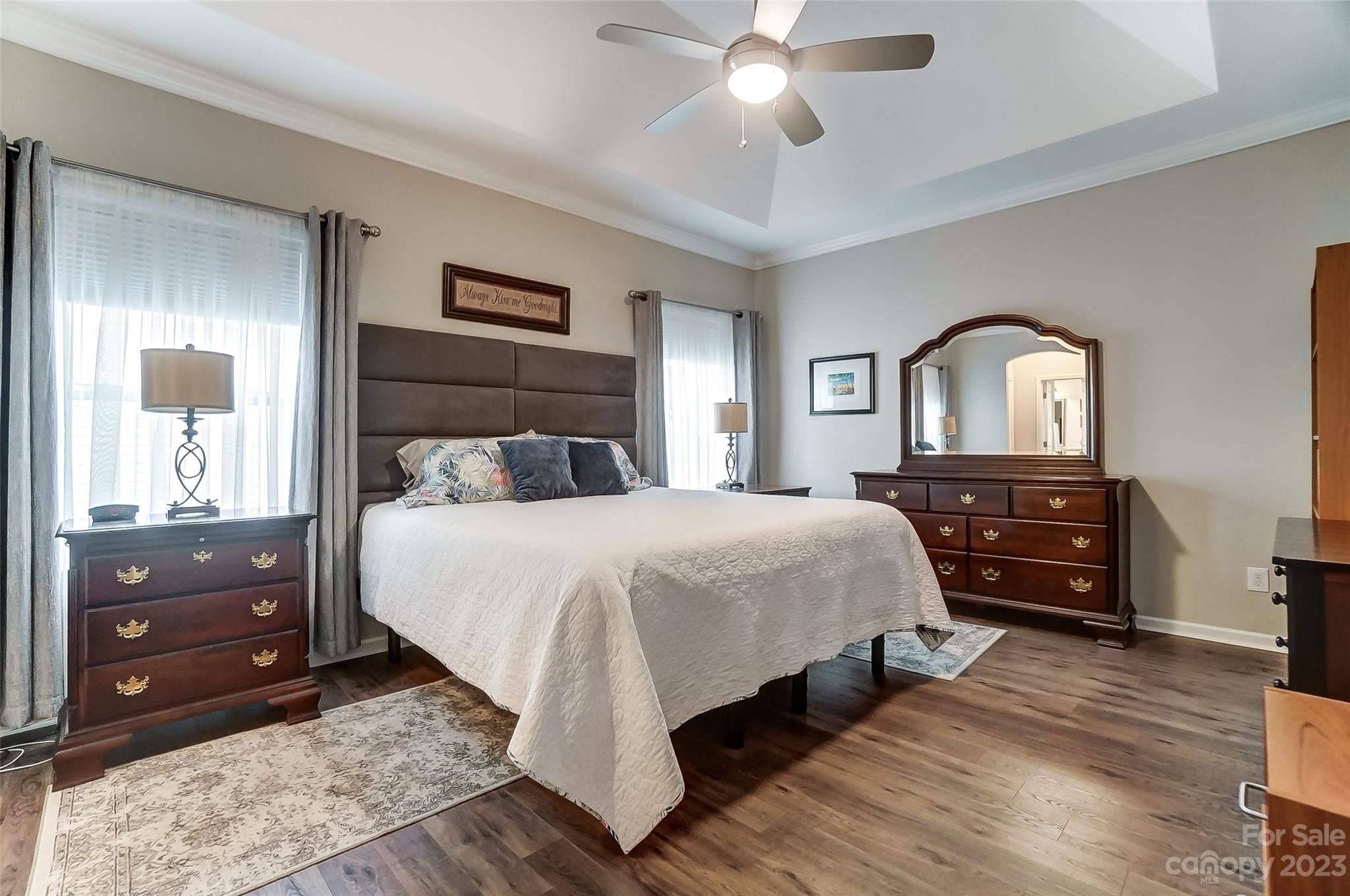 1862 Larkspur Way Tega Cay, SC 29708 - Photo 22 of 37 a bedroom with a bed and a dresser