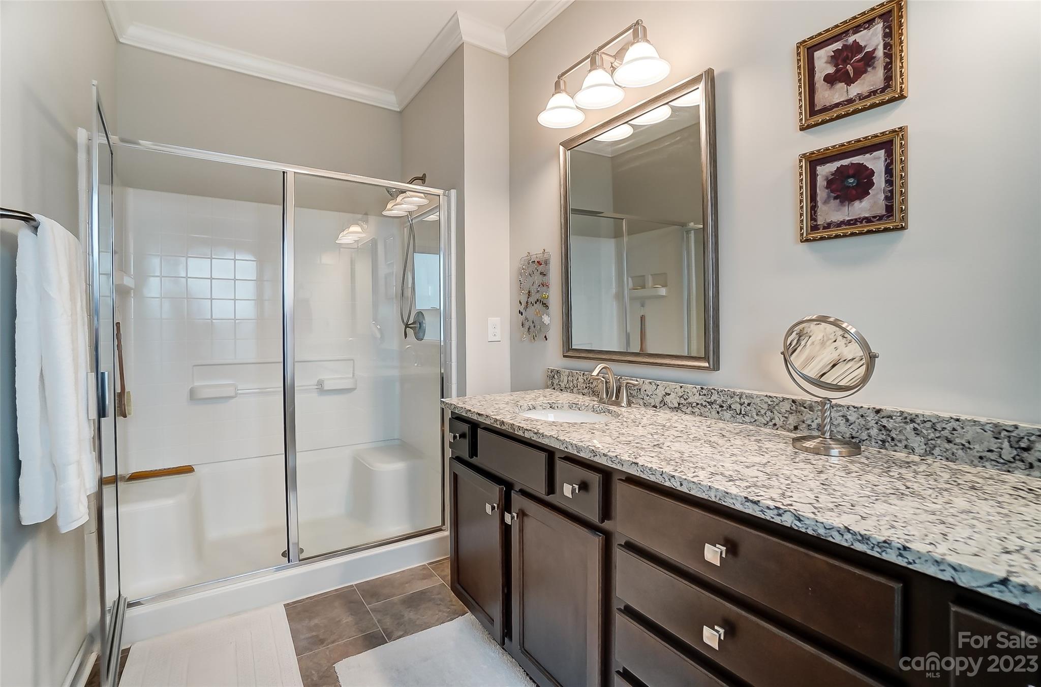1862 Larkspur Way Tega Cay, SC 29708 - Photo 25 of 37 a bathroom with a granite countertop sink and a mirror