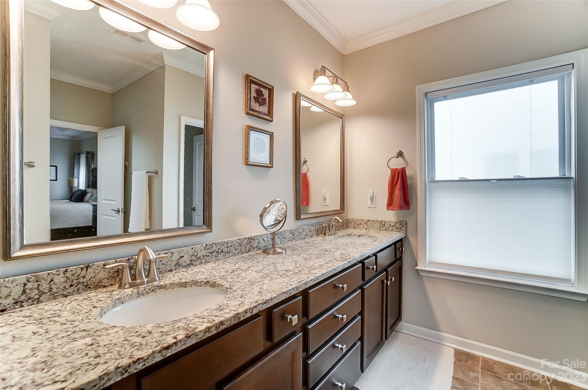 1862 Larkspur Way Tega Cay, SC 29708 - Photo 26 of 37 a bathroom with a granite countertop sink and a mirror