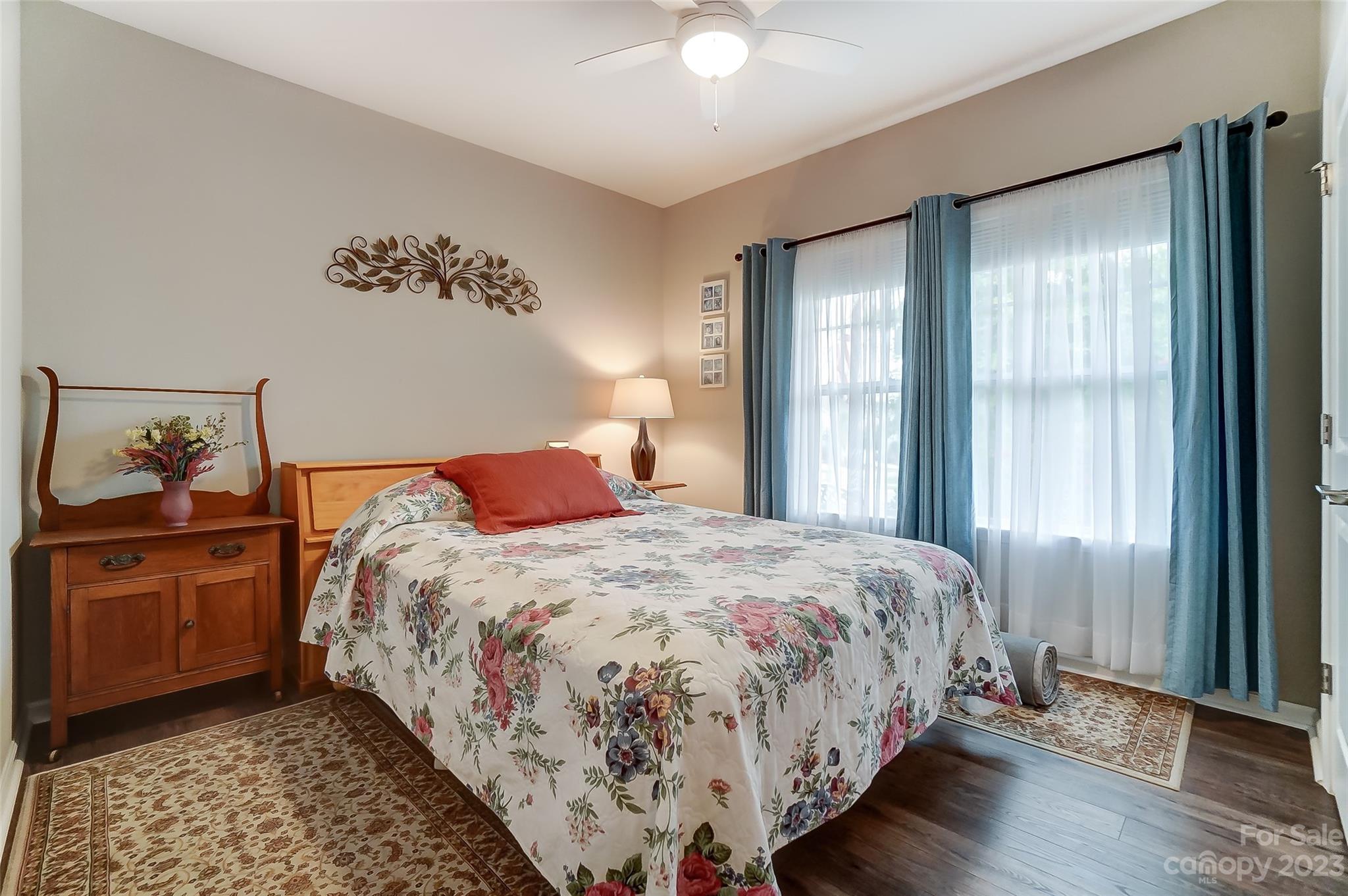 1862 Larkspur Way Tega Cay, SC 29708 - Photo 28 of 37 a bedroom with a bed and wooden floor