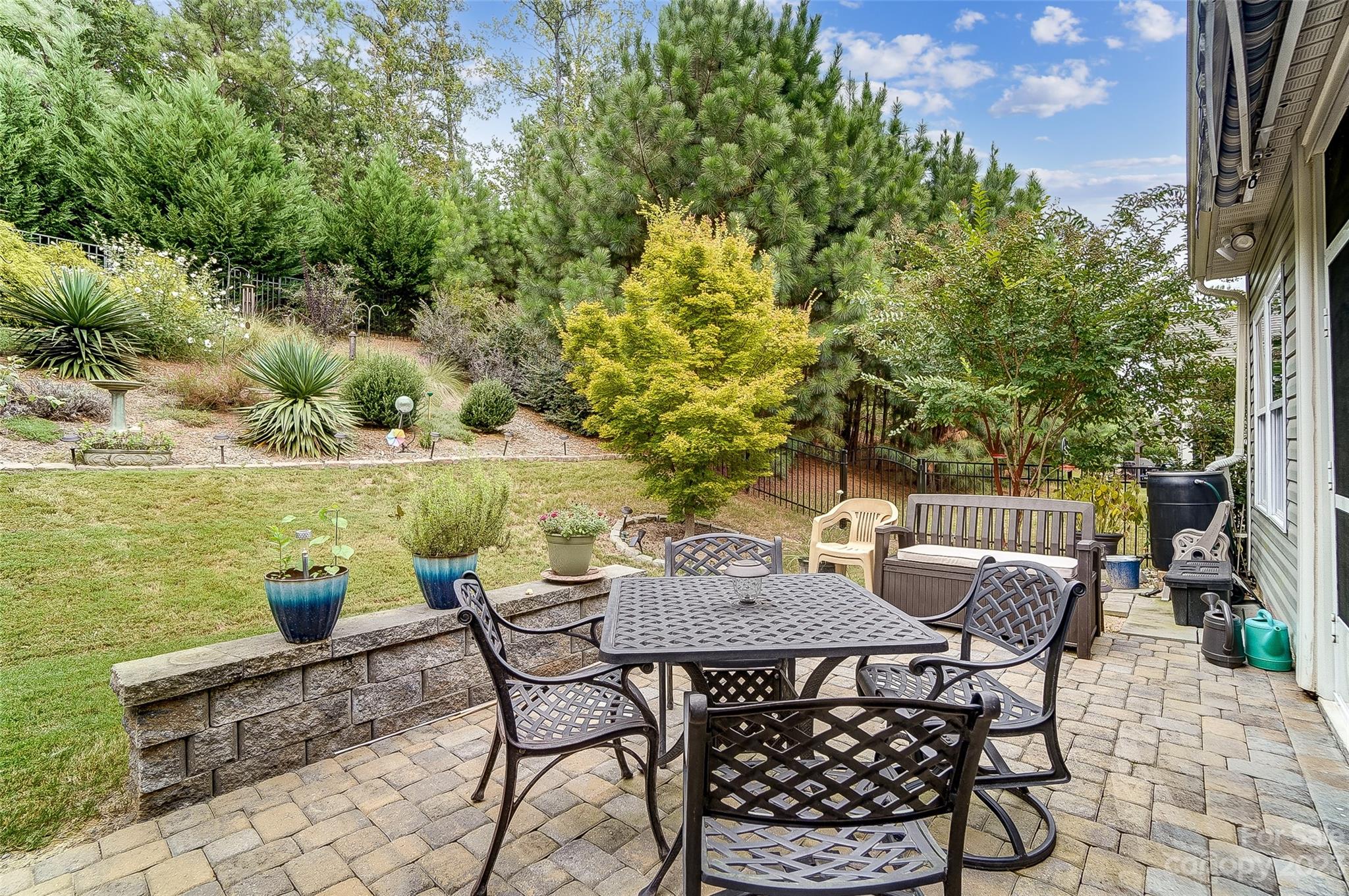1862 Larkspur Way Tega Cay, SC 29708 - Photo 36 of 37 a view of a patio with furniture and a lake view