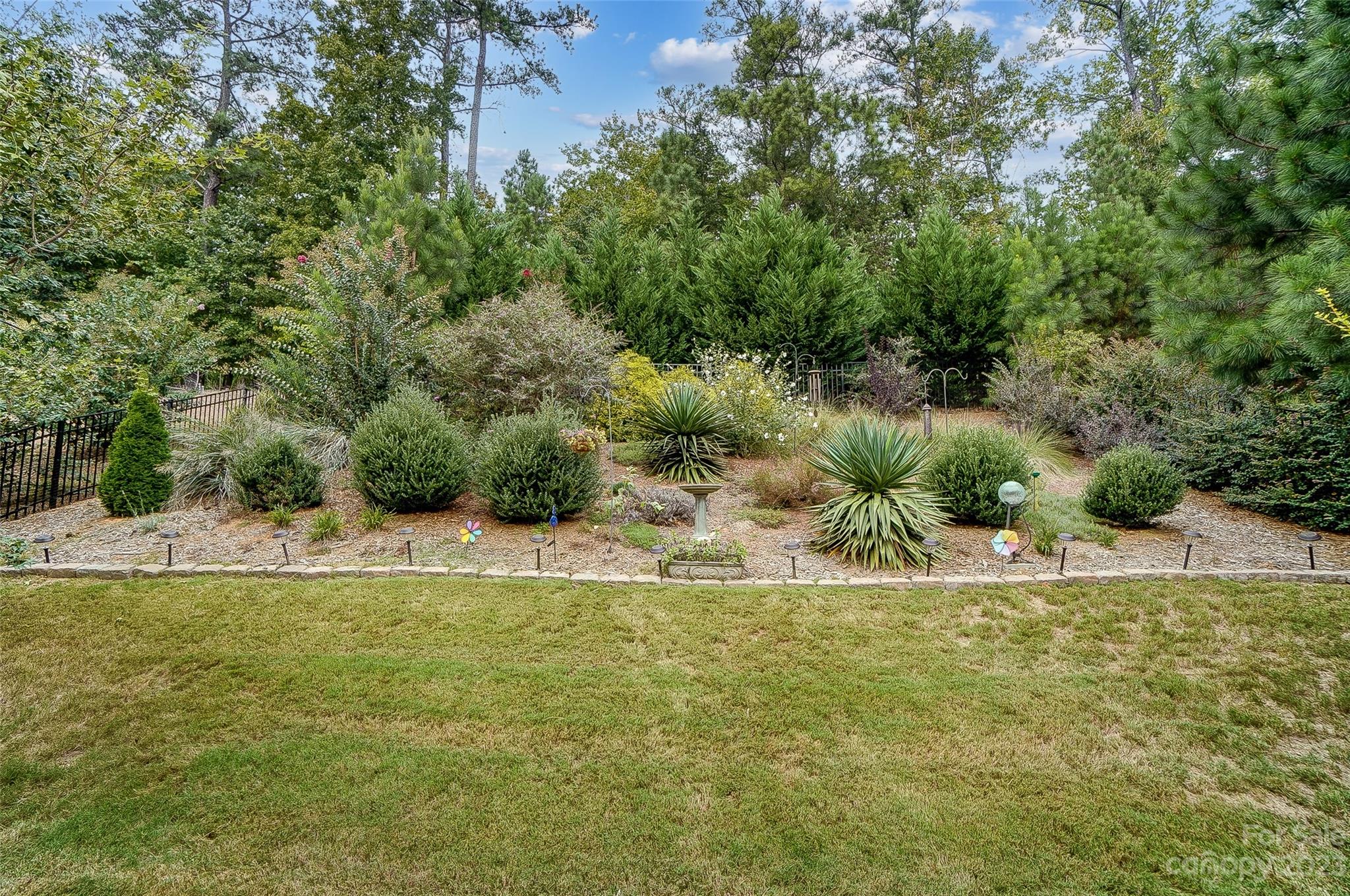 1862 Larkspur Way Tega Cay, SC 29708 - Photo 37 of 37 a view of a swimming pool with a yard