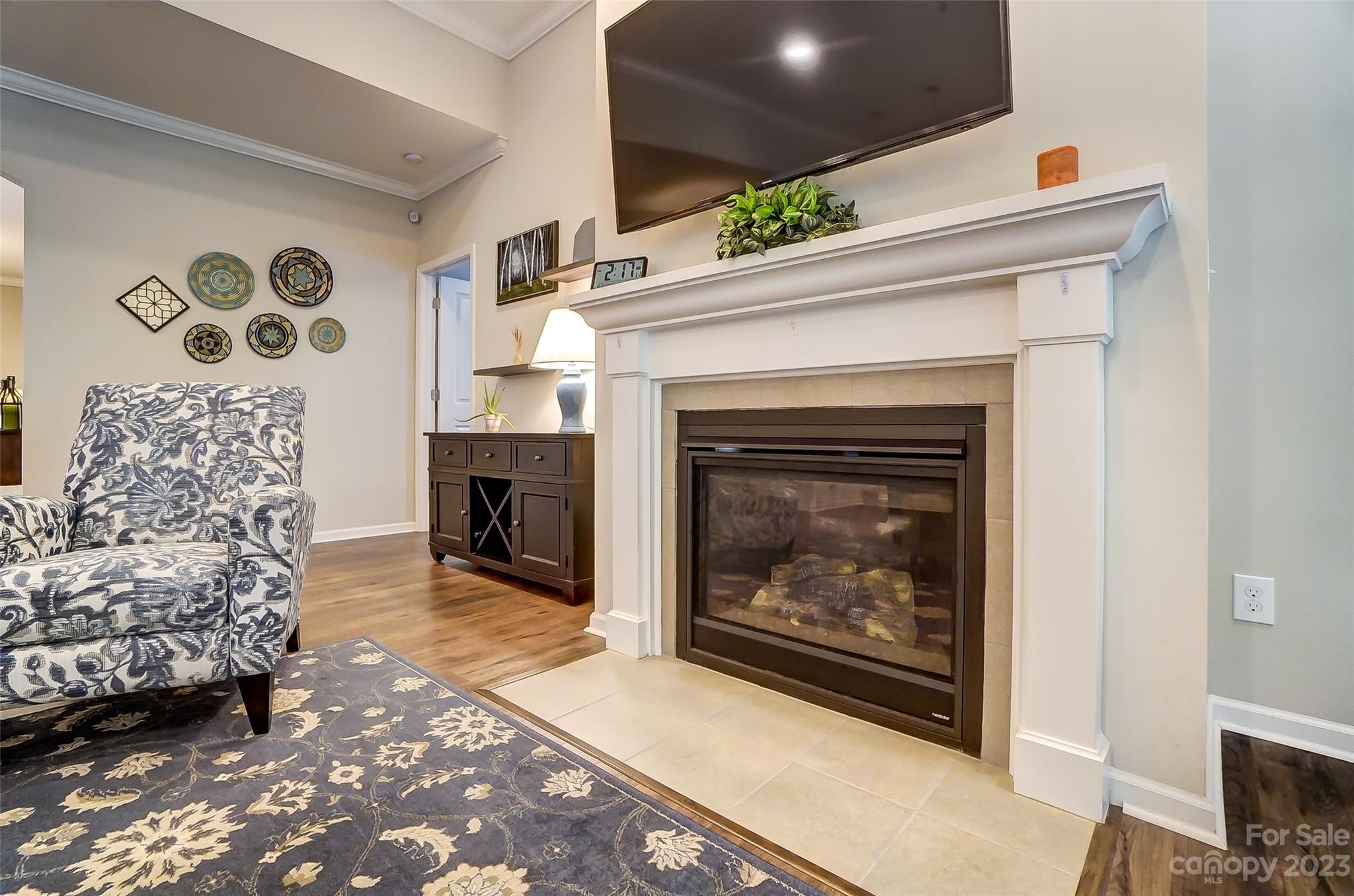 1862 Larkspur Way Tega Cay, SC 29708 - Photo 8 of 37 a living room with a fireplace