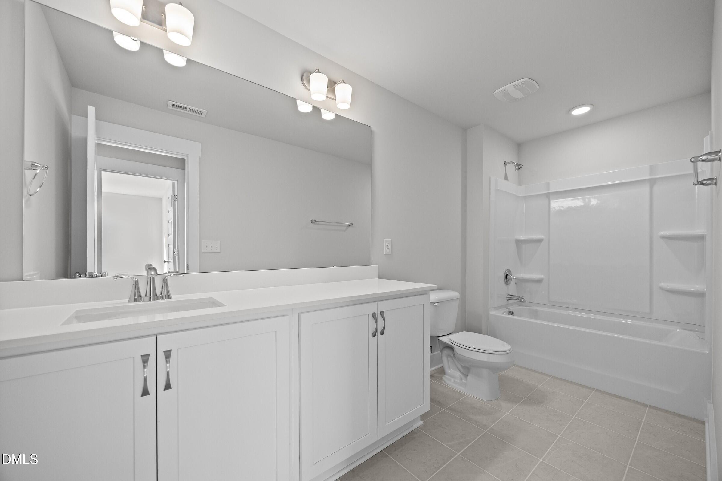 2916 Alyssa Court Raleigh, NC 27604 - Photo 16 of 21 Secondary Bathroom - Classic White Button