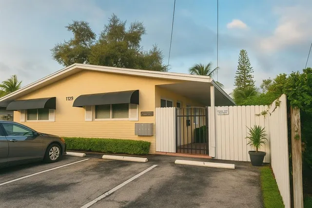 a view of a car parked in front of a house