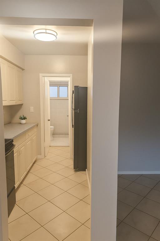 1129 Northeast 5th Terrace, Unit 2 Fort Lauderdale, FL 33304 - Photo 4 of 6 a bathroom with a sink and a mirror