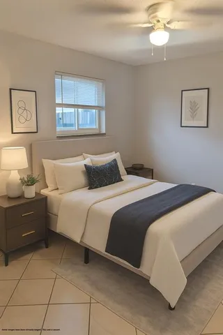 a bedroom with a bed and window