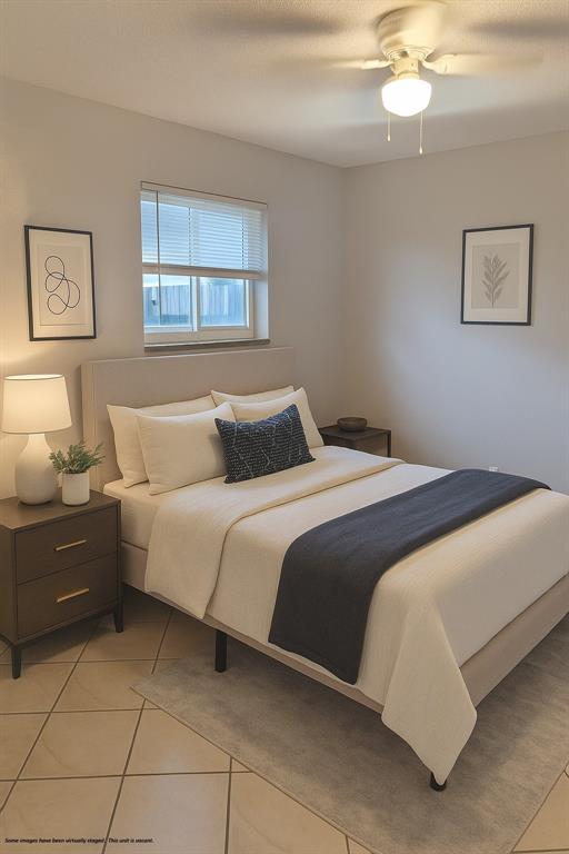 1129 Northeast 5th Terrace, Unit 2 Fort Lauderdale, FL 33304 - Photo 6 of 6 a bedroom with a bed and window