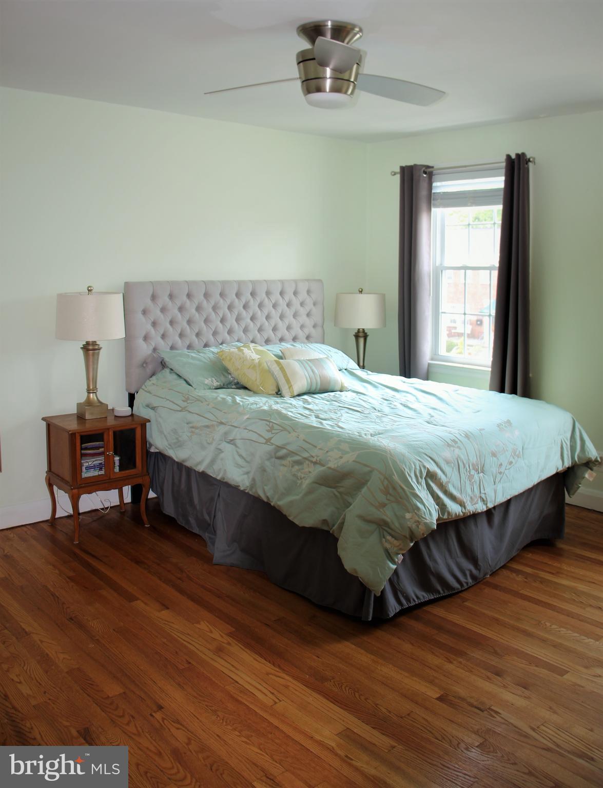 1746 Glen Ridge Road Towson, MD 21286 - Photo 30 of 48 a bedroom with a bed and wooden floor