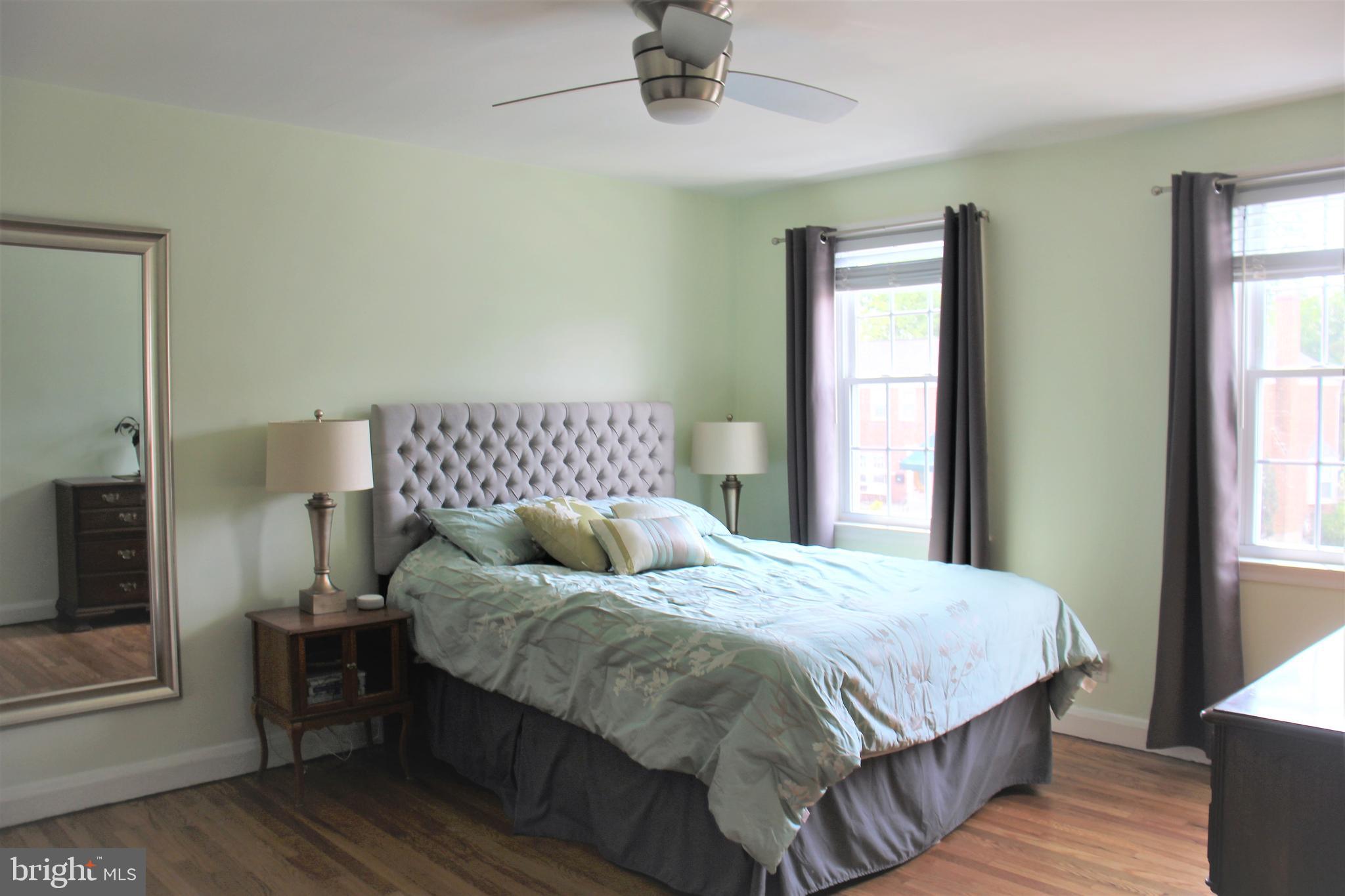 1746 Glen Ridge Road Towson, MD 21286 - Photo 31 of 48 a bedroom with a bed and wooden floor
