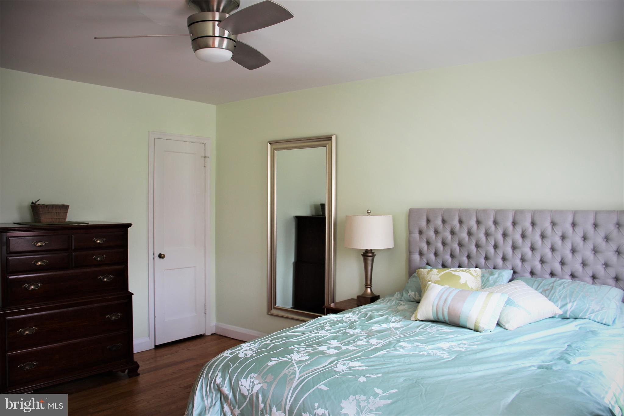 1746 Glen Ridge Road Towson, MD 21286 - Photo 32 of 48 a bedroom with a bed and a dresser