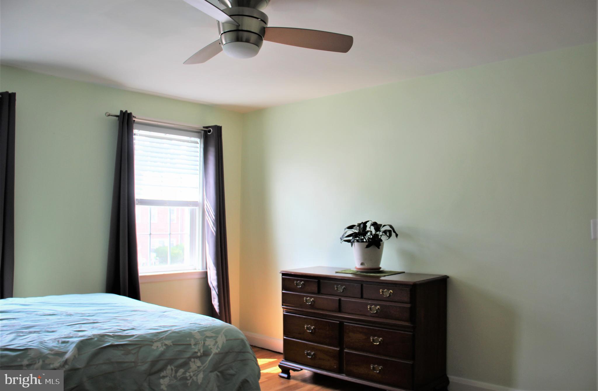 1746 Glen Ridge Road Towson, MD 21286 - Photo 35 of 48 a bedroom with a bed and a chandelier