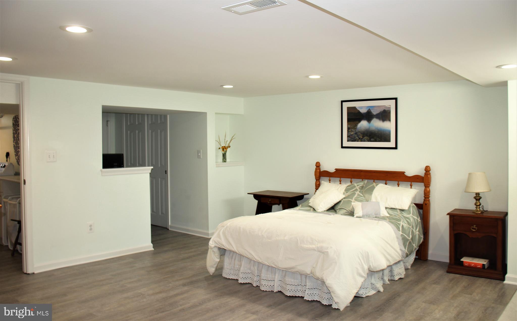1746 Glen Ridge Road Towson, MD 21286 - Photo 36 of 48 a bedroom with a bed and a night stand