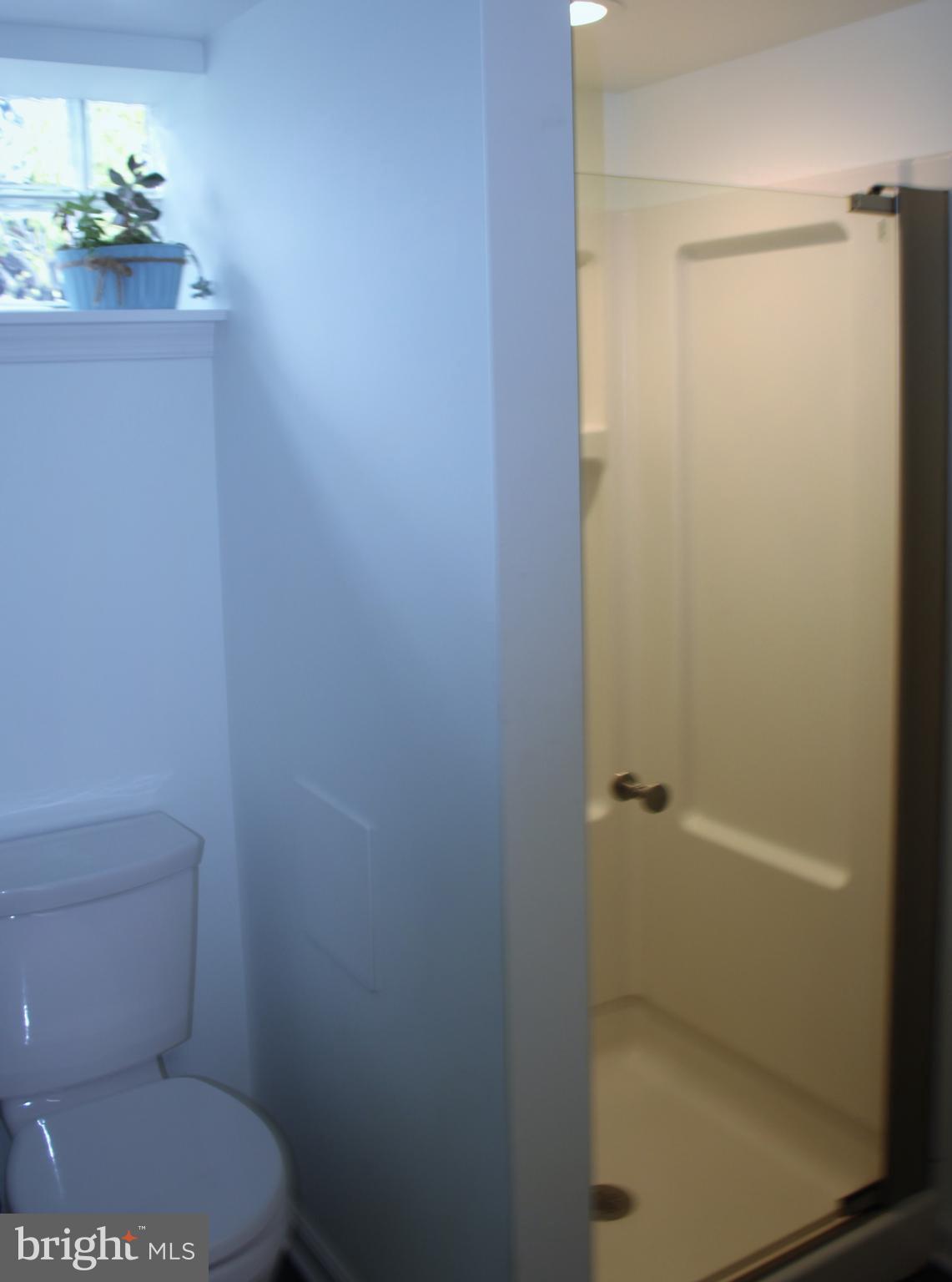 1746 Glen Ridge Road Towson, MD 21286 - Photo 42 of 48 a white toilet sitting next to a shower