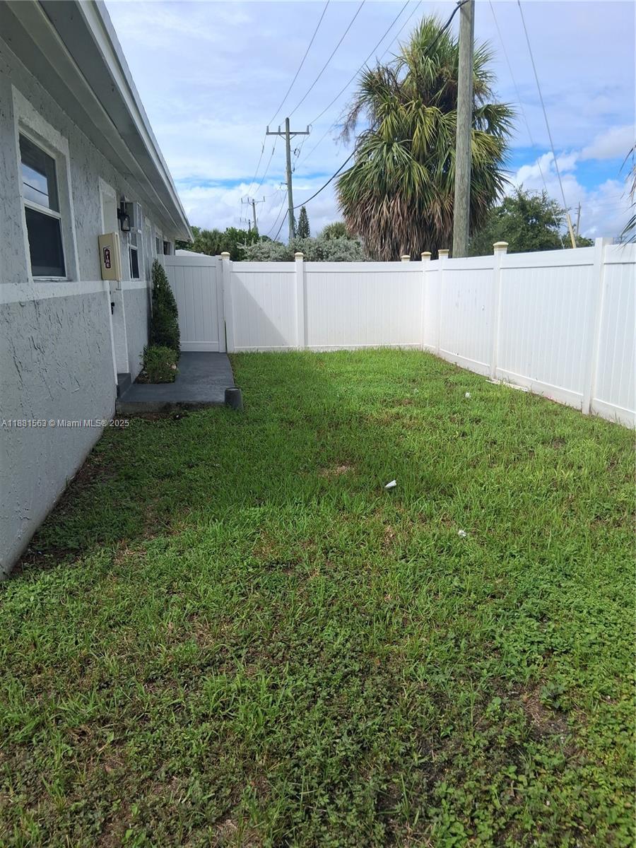 2710 Northwest 6th Street, Unit A Pompano Beach, FL 33069 - Photo 2 of 15 a view of a back yard