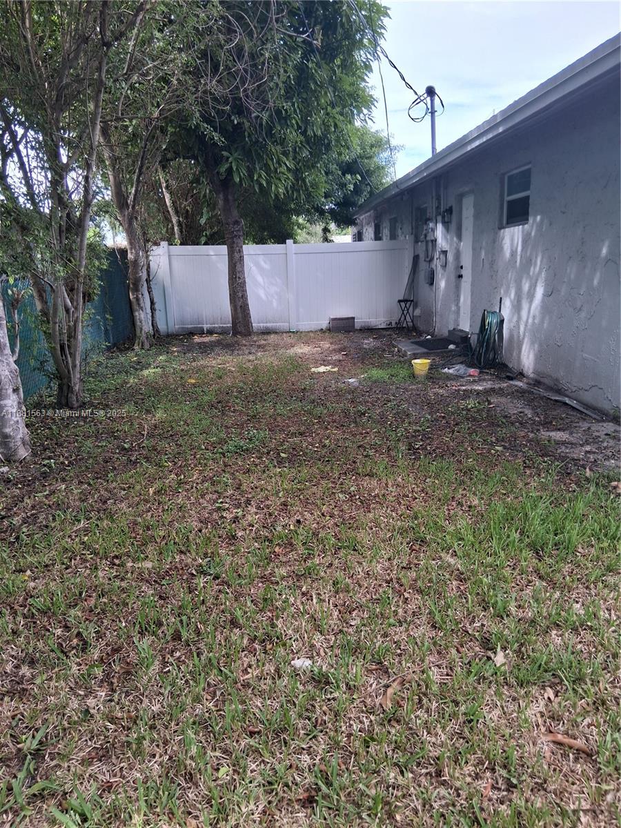 2710 Northwest 6th Street, Unit A Pompano Beach, FL 33069 - Photo 4 of 15 a view of a backyard