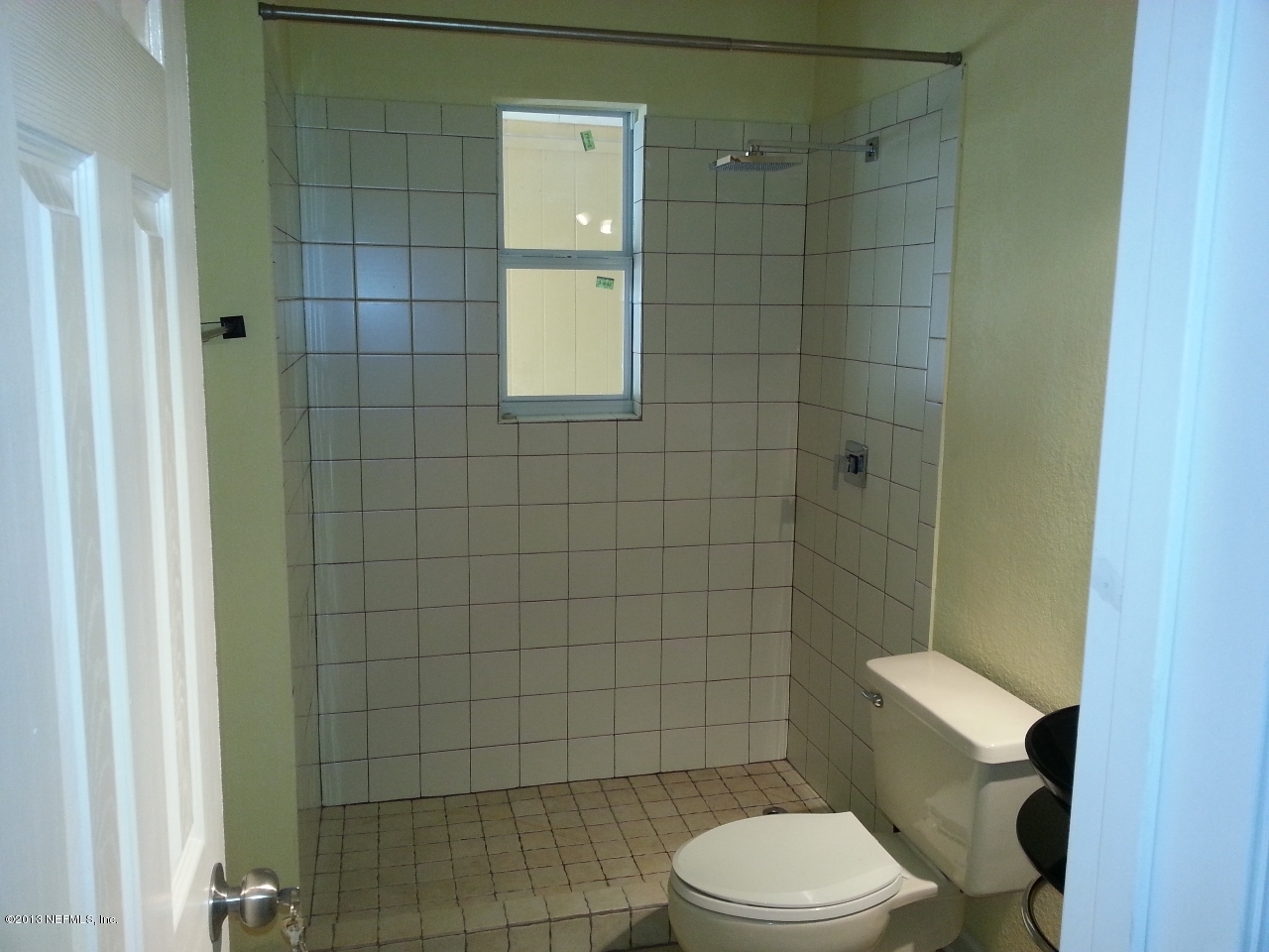 7253 Sandhurst Road South Jacksonville, FL 32277 - Photo 12 of 13 a white toilet sitting next to a bathroom sink