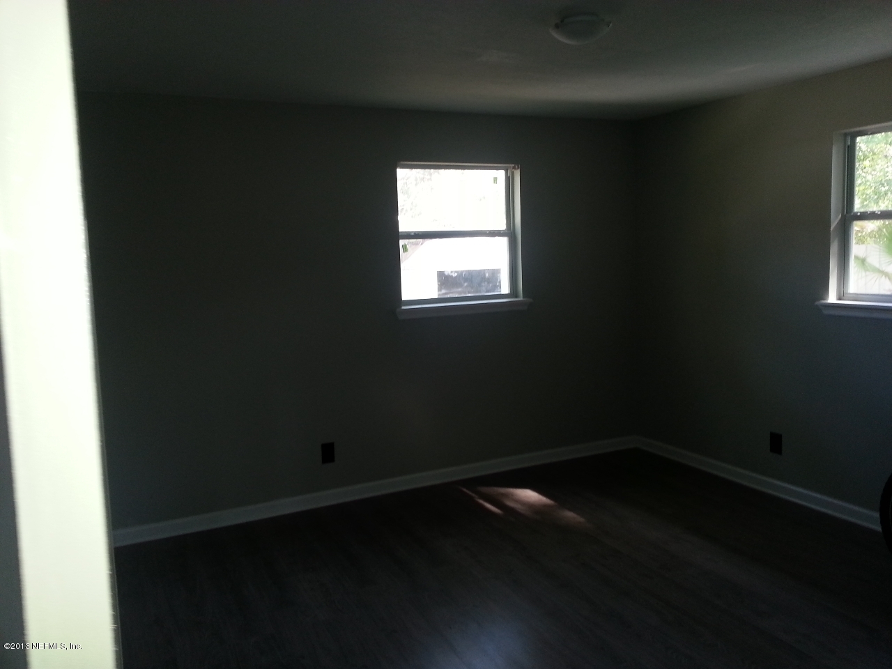 7253 Sandhurst Road South Jacksonville, FL 32277 - Photo 4 of 13 a small space with wooden floor and windows