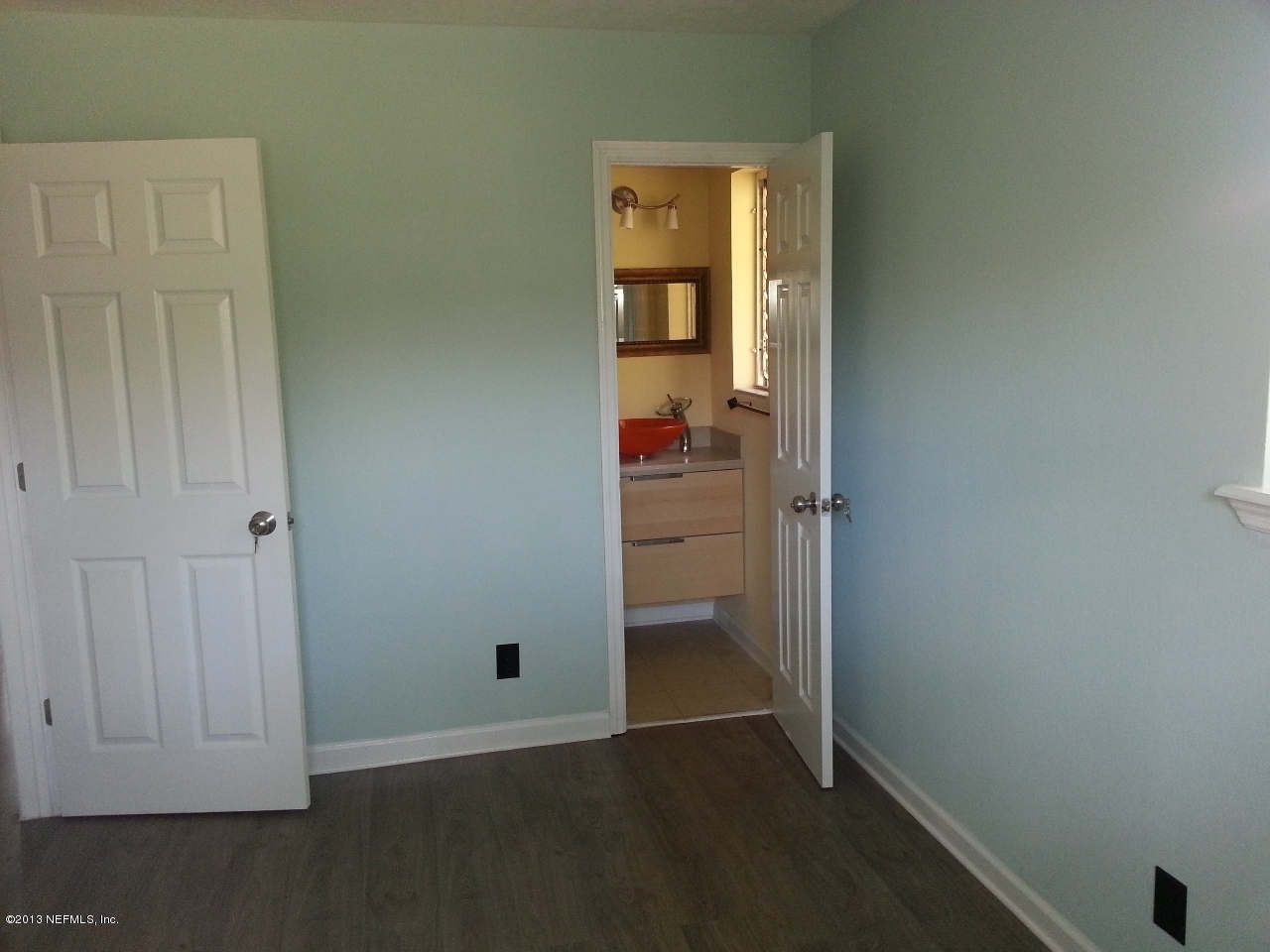 7253 Sandhurst Road South Jacksonville, FL 32277 - Photo 6 of 13 an empty room that has a wooden cupboard