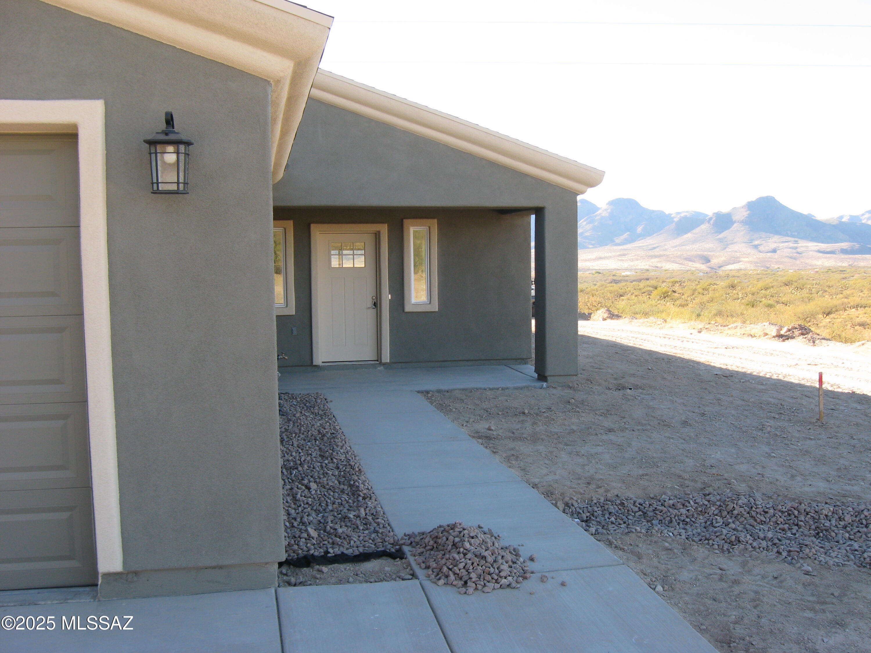 1734 Circulo Badajada Rio Rico, AZ 85648 - Photo 2 of 32 a view of a house with a yard