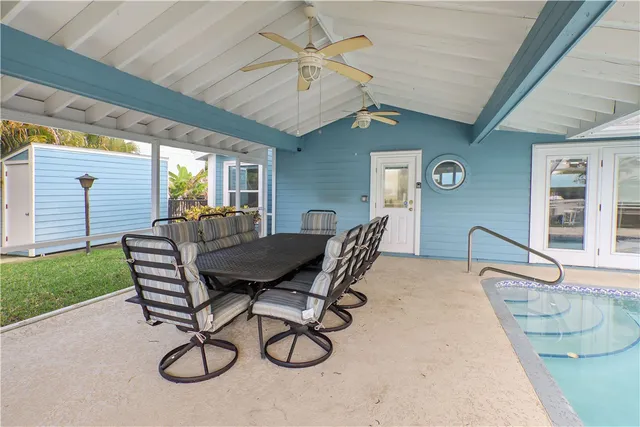 a view of a terrace with furniture and a kitchen