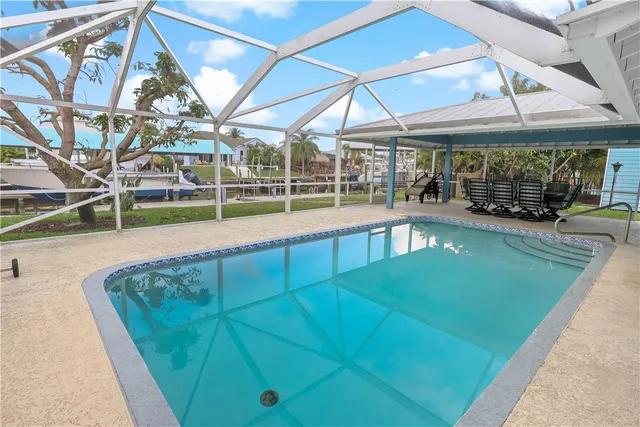 an aerial view of a houses with a yard