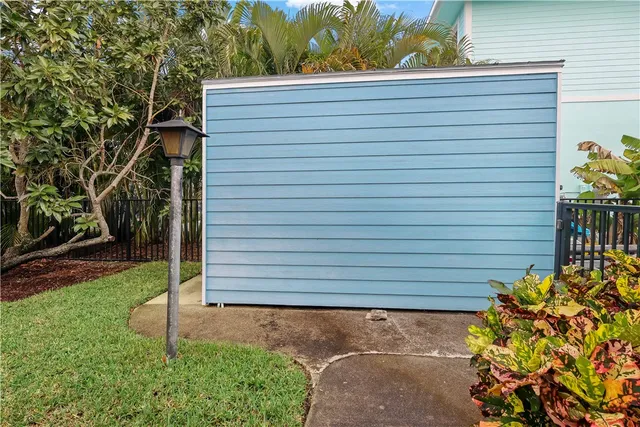 an aerial view of a house with a yard and garden
