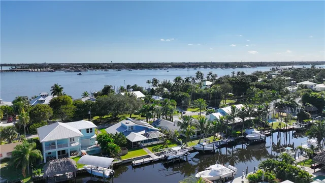an aerial view of a house with a yard