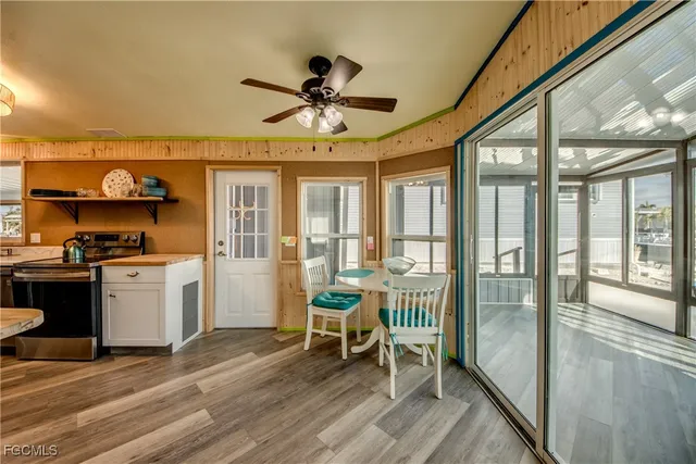 a kitchen with stainless steel appliances granite countertop a sink and cabinets